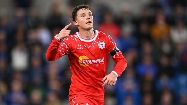 Ali Coote of Shelbourne celebrates after scoring his side's second goal during the UEFA Conference League Play-off Round second leg match between Linfield and Shelbourne at the Clearer Twist National Football Stadium, Windsor Park in Belfast. Photo by Ste