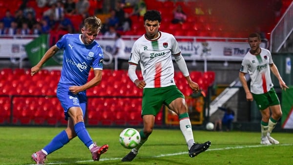 15 August 2025; Conan Noonan of Waterford shoots on goal head of Freddie Anderson of Cork City during the Sports Direct Men’s FAI Cup third round match between Cork City and Waterford at Turner's Cross in Cork. Photo by Tyler Miller/Sportsfile