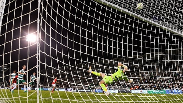 Shamrock Rovers goalkeeper Ed McGinty makes a save during the UEFA Conference League Play-off Round second leg match between Shamrock Rovers and CD Santa Clara at Tallaght Stadium in Dublin