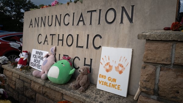 flowers and other mementoes in front of Annunciation Catholic Church minneapolis