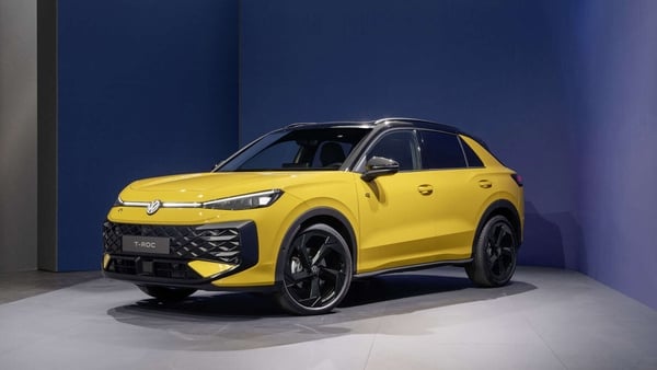 A photo of a yellow and black car