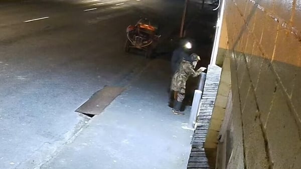 A screengrab from CCTV footage in New Zealand believed to show Tom Phillips and one of his children breaking into a store in Piopio