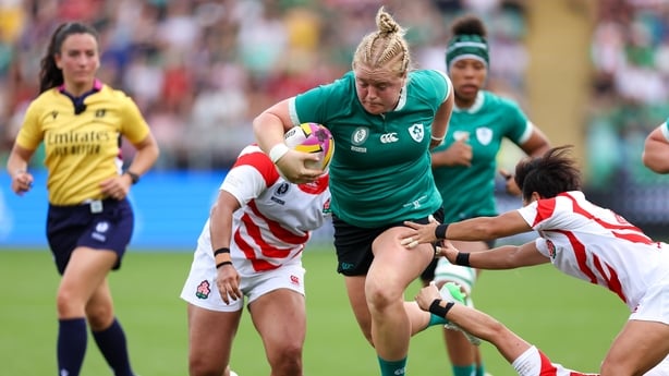 24 August 2025; Cliodhna Moloney Macdonald of Ireland evades the tackle of Japan players Megumi Abe, left, and Minori Yamamoto during the Women's Rugby World Cup 2025 Pool C match between Ireland and Japan at Franklin's Gardens in Northampton, England. Photo by Harry Murphy/Sportsfile