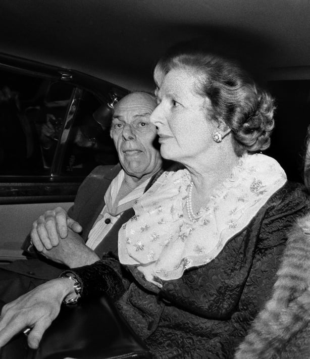 British Prime Minister Margaret Thatcher and her husband Denis (1915 - 2003) leave the Grand Hotel in Brighton, after a bomb attack by the IRA, 12th October 1984. They and many other politicians were staying at the hotel during the Conservative Party conference, Five people were killed and over thir