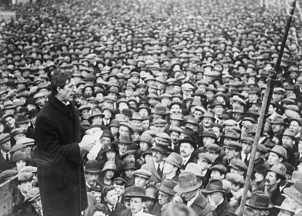 Eamon de Valera, reading from notes, in front of a huge crowd