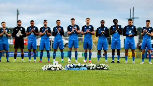 The Finn Harps team stands for a minute's applause in remembrance of their late former manager Ollie Horgan