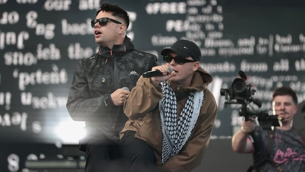 Kneecap's Moglai Bap, Mo Chara, and DJ Provai perform on stage at Belfast Vital.