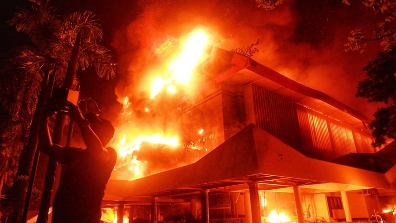 The building of Makassar City Regional House of Representatives is set on fire during a protest in Makassar, Indonesia