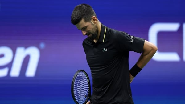 NEW YORK, NEW YORK - AUGUST 29: Novak Djokovic of Serbia holds his back against Cameron Norrie of the United Kingdom during their Men's Singles Third Round match on Day Six of the 2025 US Open at USTA Billie Jean King National Tennis Center on August 29,