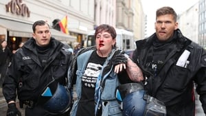 Irish protestor shares experience of being punched by German police show image