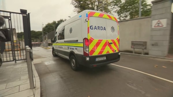 A garda van is seen entering the Criminal Courts of Justice where Darragh O'Brien was charged in connection with the serious assault of a tourist in Temple Bar