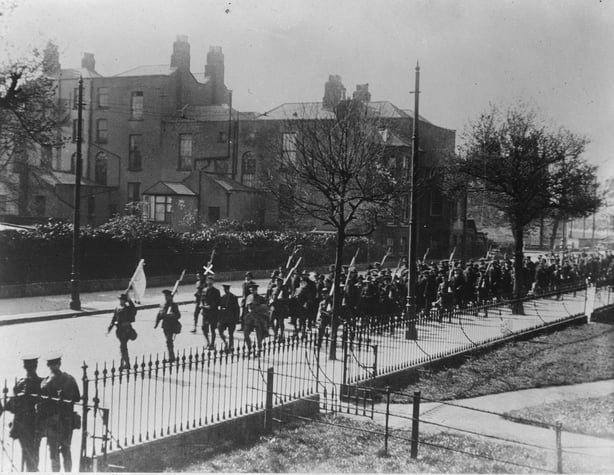 Prisoners being taken away from Boland's Mill by British soldiers after the Easter Rising, Dublin 1916. Eamon de Valera, who commanded the Third Brigade at Boland's Mill, is marked with an 'x'.