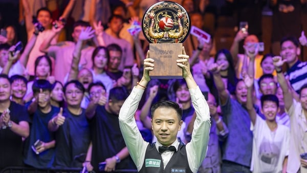 WUHAN, CHINA - AUGUST 30: Xiao Guodong of China poses for photo with trophy after winning the final match against Gary Wilson of England on day seven of the WST 2025 Wuhan Open at the Optics Valley Gymnasium of Huazhong University of Science and Technolog