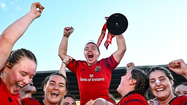Maeve Óg O'Leary of Munster, centre, celebrates with team-mates and the cup after the Vodafone Women’s Interprovincial Championship final match between Leinster and Munster at Energia Park in Dublin.