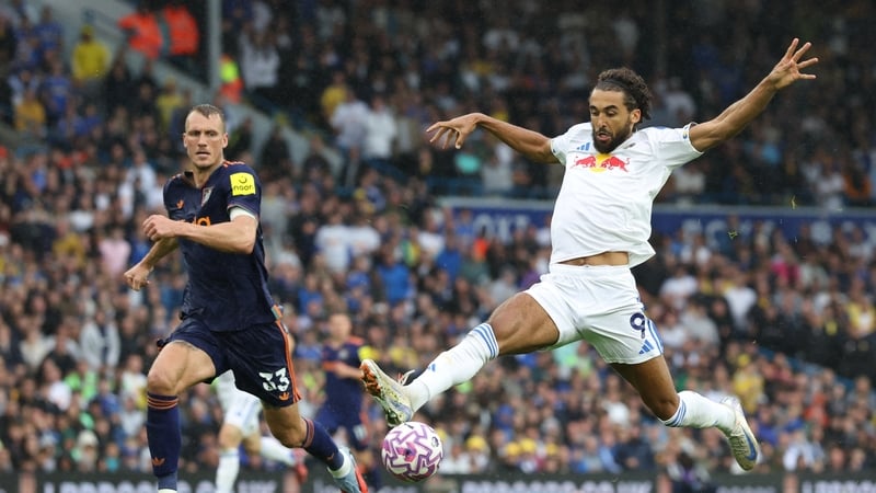 Leeds United's Dominic Calvert-Lewin (R) controls the ball under pressure from Dan Burn