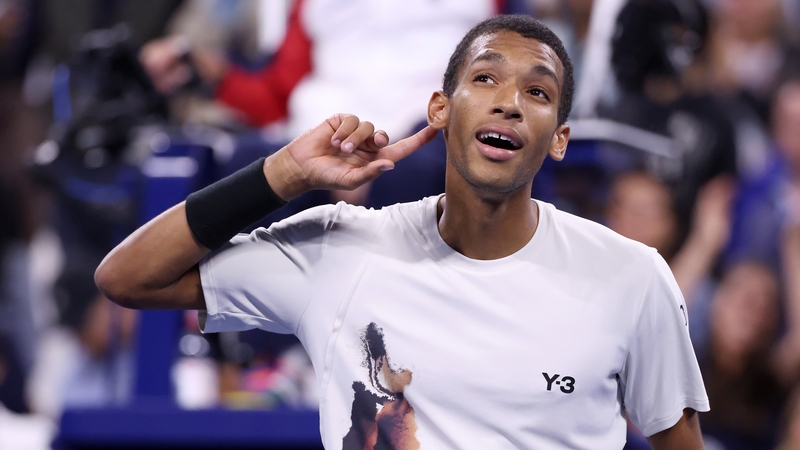 Felix Auger-Aliassime celebrates his win
