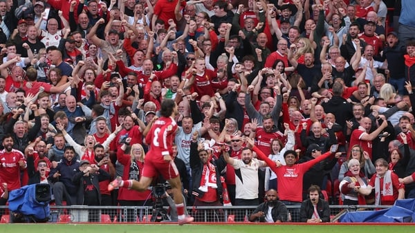 LIVERPOOL, ENGLAND - AUGUST 31: Liverpool fans celebrate after Dominik Szoboszlai of Liverpool scored his team's first goal during the Premier League match between Liverpool and Arsenal at Anfield on August 31, 2025 in Liverpool, England. (Photo by Alex P