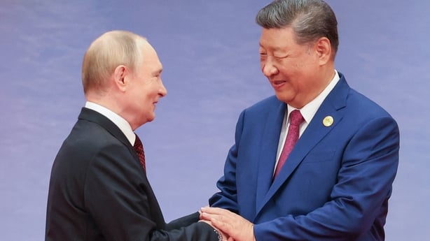 Two people shake hands
