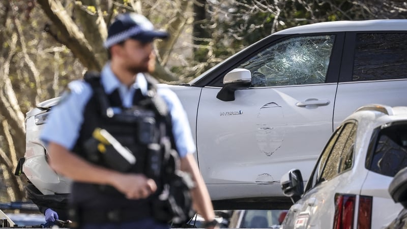 A tow truck removes a car after it was driven into the gates of the Russian consulate in Sydney