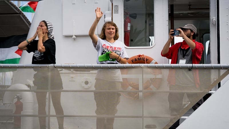 Greta Thunberg waves goodbye as the flotilla set sail, before stormy weather forced its return to port