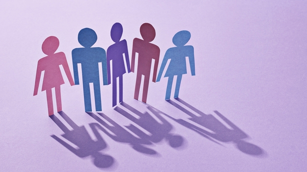 Five silhouettes of figures of varying genders on a purple background, concept image