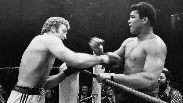 Heavyweight boxers Joe Bugner (left) and Muhammad Ali (1942 - 2016) at their exhibition match at the Royal Albert Hall, London, 3rd December 1974