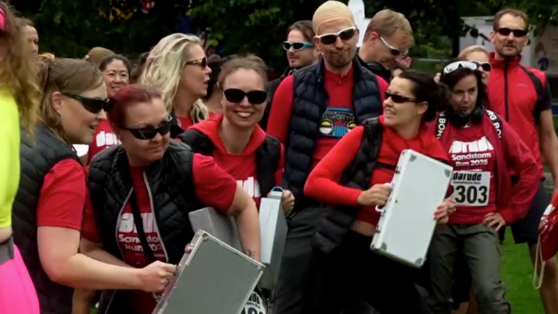 Runners dressed in red and carrying briefcases raced around Helsinki to celebrate 25 years of the dance hit Sandstorm / Image: Reuters