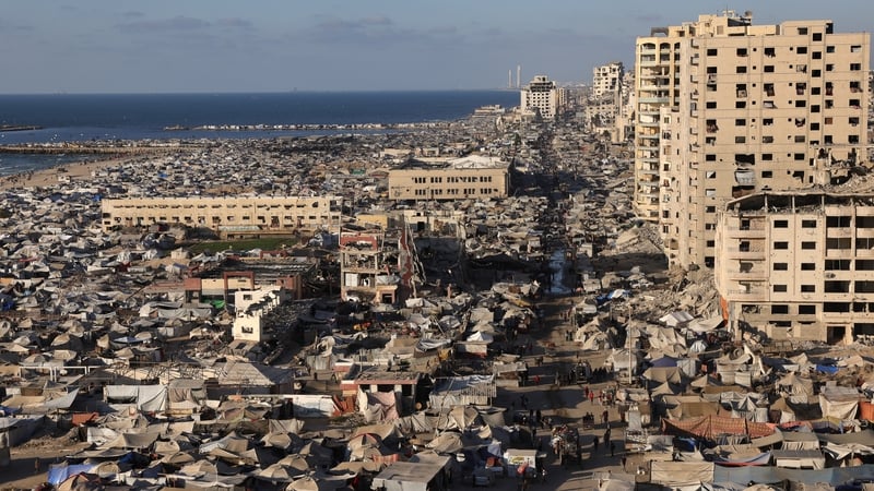 An aerial view of tents housing Palestinians and widespread destruction in Gaza City
