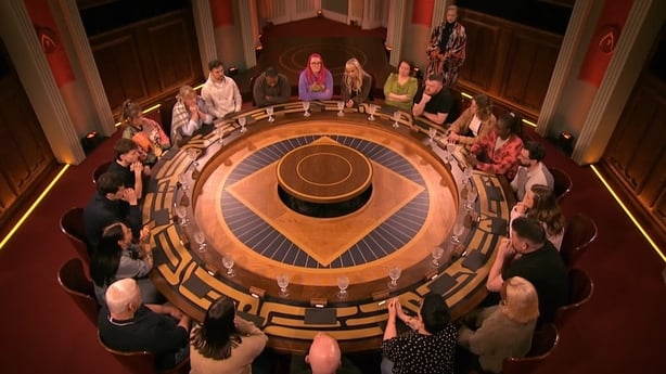 The contestants gather around the round table on The Traitors Ireland