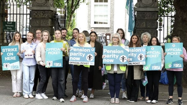 School caretakers and secretaries are pictured on the picket line outside St Vincent dePaul Infant primary school in Dublin