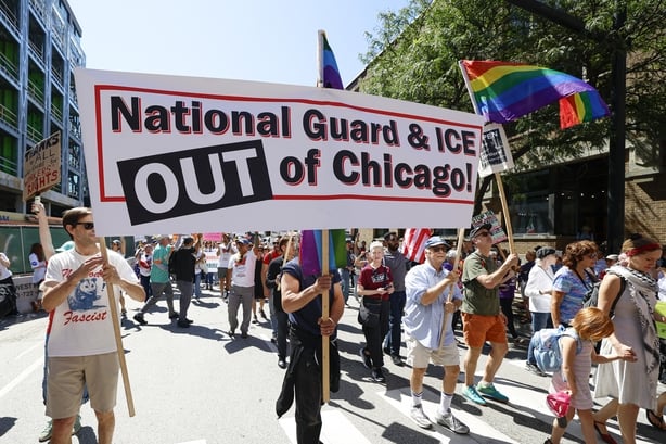 Protesters hold signs as they march during a "Workers over billionaires" rally on Labor Day in Chicago on September 1, 2025. (Photo by KAMIL KRZACZYNSKI / AFP) (Photo by KAMIL KRZACZYNSKI/AFP via Getty Images)