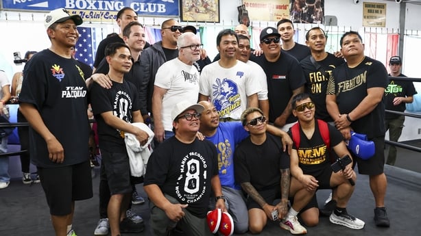 LOS ANGELES, CALIFORNIA - JUNE 25: Trainer Freddie Roach (center left) and Manny Pacquiao (center right) pose with their team at Wild Card Boxing Club on June 25, 2025 in Los Angeles, California. (Photo by Melina Pizano/Getty Images)