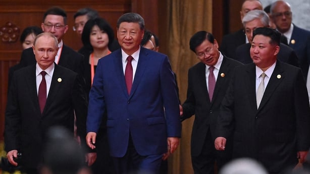 A picture of Russia's President Vladimir Putin with China's President Xi Jinping and North Korea's leader Kim Jong Un