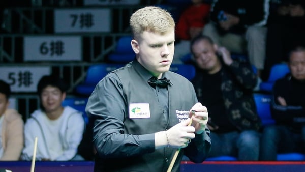 WUHAN, CHINA - OCTOBER 07: Aaron Hill of Ireland chalks the cue in the second round match against Kyren Wilson of England on day 2 of 2024 Wuhan Open (Snooker) at China Optics Valley Convention & Exhibition Centre on October 7, 2024 in Wuhan, Hubei Provin