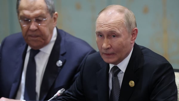 TIANJIN, CHINA - SEPTEMBER 1 (RUSSIA OUT) Russian President Vladimir Putin (R) speaks to Indian Prime Minister Narendra Modi (not pictured) as Russian Foreign Minister Sergey Lavrov (L) looks on while their bilateral meeting during the 2025 Shanghai Coope