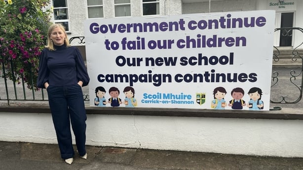 Louise Murray from the New School Committee for Scoil Mhuire stands out the school