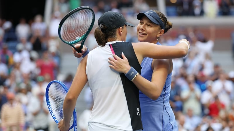 Amanda Anisimova, right, embraces Iga Swiatek after her quarter-final victory at Arthur Ashe Stadium