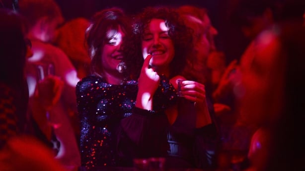 Caroline Menton as Rachel and Louisa Harland as Anna dancing on a night out
