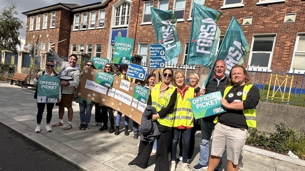 A photo of SNAs, caretakers and supporters during strike action outside St Joseph's School in Fairview