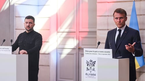 Ukrainian President Volodymyr Zelensky and French President Emmanuel Macron speak following the Coalition of the Willing Summit