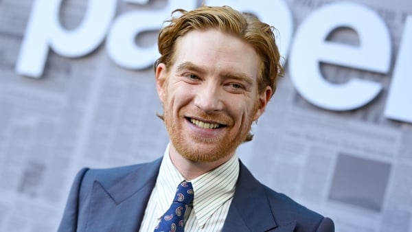 Domhnall Gleeson smiles on the red carpet for the premiere of his new TV series The Paper