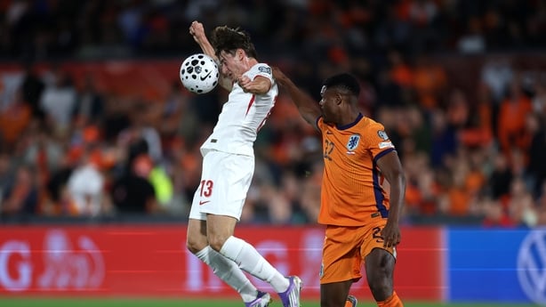 ROTTERDAM, NETHERLANDS - SEPTEMBER 04: Jakub Kaminski of Poland leaps for the ball ahead of Denzel Dumfries of the Netherlands during the FIFA World Cup 2026 qualifier match between Netherlands and Poland at De Kuip on September 04, 2025 in Rotterdam, Netherlands. (Photo by Dean Mouhtaropoulos/Getty