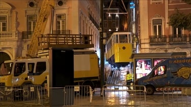Workers lift wrecked Lisbon funicular from tracks after crash