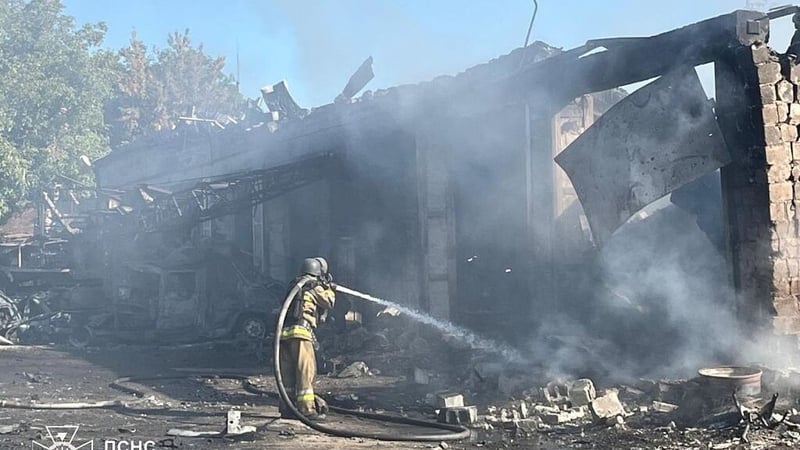 Ukrainian firefighters at a building in Donetsk, which was damaged in a Russian attack yesterday