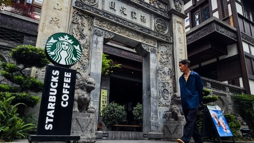 Starbucks invited around 10 potential buyers to submit non-binding bids for a portion of its China operations by early September, reports say