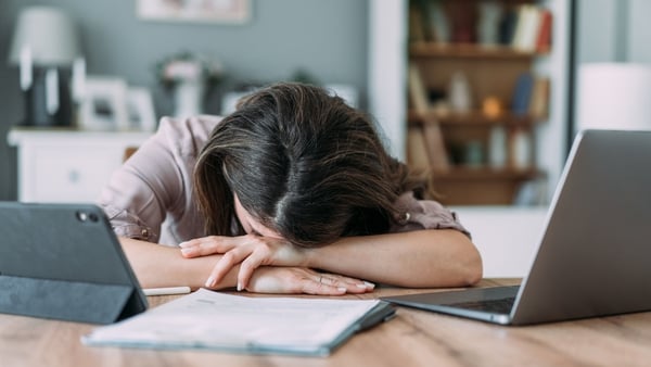 Shot of businesswoman sleeping on her desk while working from home.