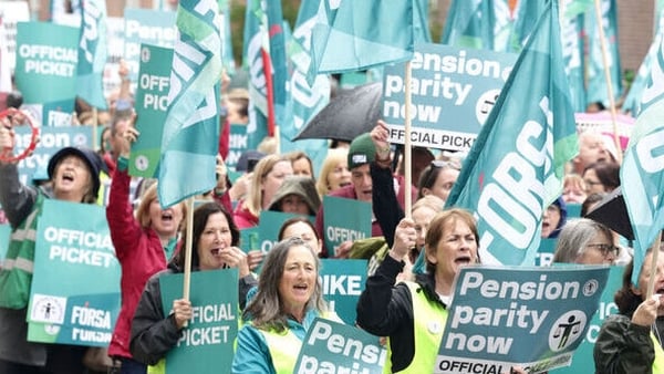 School secretaries and caretakers pictured outside the Department of Finance, before a rally in Dublin city centre