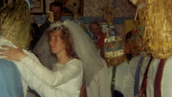 A bride dancing with a strawboy
