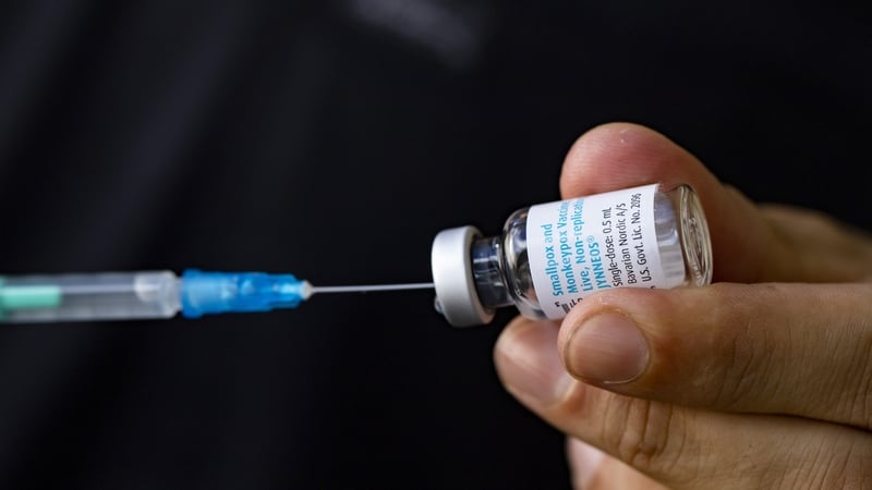 A medic prepares a syringe with the vaccine against smallpox and monkeypox