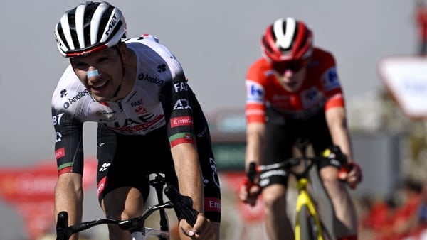 Team UAE's Joao Almeida followed by overall race leader Jonas Vingegaard of Team Visma-Lease a Bike at the finish line of the 13th stage of the Vuelta a Espana